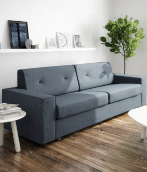 Blueish gray sofa in sunny livingroom